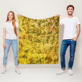 Scratches auf einem leicht gepunkteten ochgelben B Fleecedecke