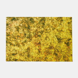 Scratches auf einem leicht gepunkteten ochgelben B Fußmatte