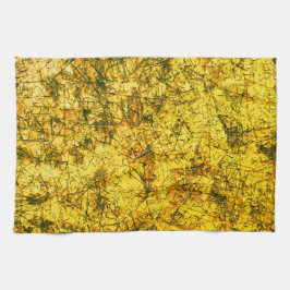 Scratches auf einem leicht gepunkteten ochgelben B Geschirrtuch