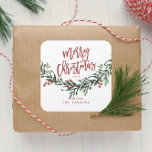 Script Merry Christmas Watercolor Quadratischer Aufkleber<br><div class="desc">Ein festlicher,  rot,  grün und weiß fröhlicher Weihnachtsgeschenkaufkleber,  Gustenaufkleber oder Umschlaggehäuse mit fett formatierter Schrift und Aquarellgrün mit Blätter und Beeren.</div>