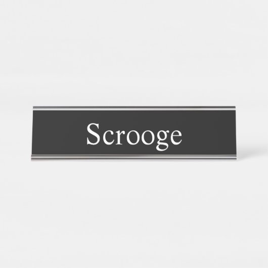 Scrooge, Schreibtischnamensplakette (Vorderseite )