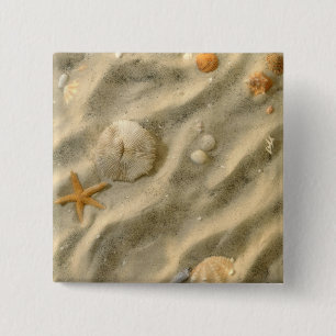 Seashells im Sand Button