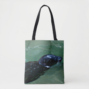 Seehund gleitet durch ruhiges Wasser Tasche