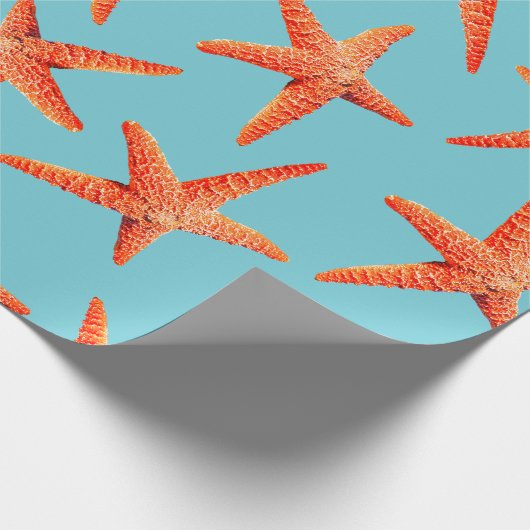 Seerote orange Küstenstarfish u. cyan-blaues Blau Geschenkpapier (Ecke)