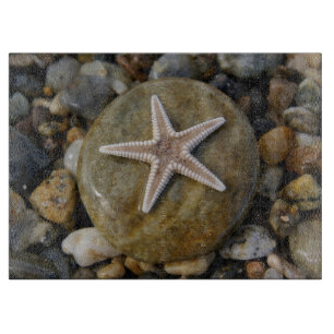 Seestern auf Stein am Strand Schneidebrett