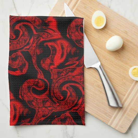 Sehr farbige rote Spiralteile auf schwarzem Hinter Geschirrtuch (Viertel Falte)