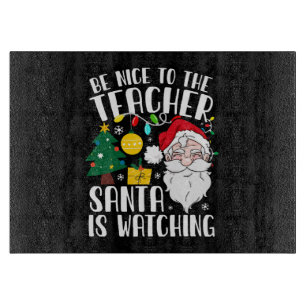 Sei nett zu dem Lehrer, der Weihnachtsmann beobach Schneidebrett