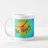 "Seien Sie das glückliche" bunte Gesicht, Kaffeetasse (Links)