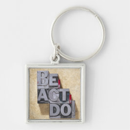 Seien Sie, fungieren Sie, tun Schlüsselanhänger