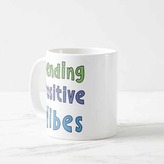Senden positiver Vibes Kaffeetasse (Vorderseite Links)