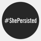 #ShePersisted, weißer Text auf schwarzen Aufkleber (Vorderseite)