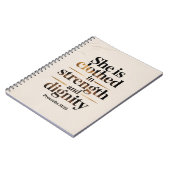 She's clothed in strength. Bible verse notebook  Notizblock (Linke Seite)