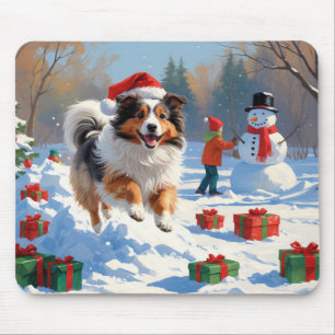 Shetland Sheepdog läuft durch Schnee mit Weihnacht Mousepad