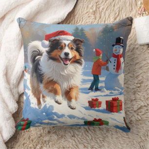 Shetland Sheepdog läuft Schnee mit Weihnachtshut Kissen