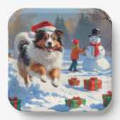 Shetland Sheepdog läuft Schnee mit Weihnachtshut Pappteller (Vorderseite)