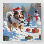 Shetland Sheepdog läuft Schnee mit Weihnachtshut Quadratische Wanduhr (Vorderseite)