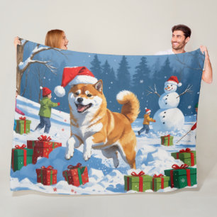 Shiba Inu läuft im Schnee mit Weihnachtsmütze Fleecedecke
