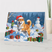 Shiba Inu läuft im Schnee mit Weihnachtsmütze Karte (Vorderseite)