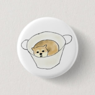 Shiba Inu-Welpe ruht in weißer Tasse Button