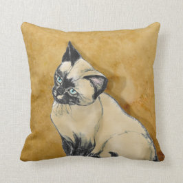 Siamesische Katze auf Gold Kissen