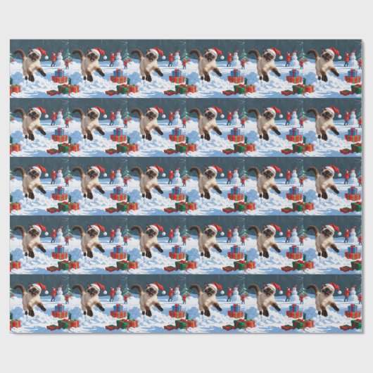 Siamische Katze läuft im Schnee mit Weihnachtsmütz Geschenkpapier (Flach)