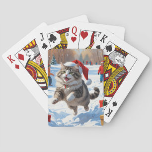 Sibirische Katze läuft im Schnee mit Weihnachtsmüt Spielkarten
