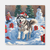 Sibirischer Husky läuft im Schnee mit Weihnachtsmü Magnet (Vorne)