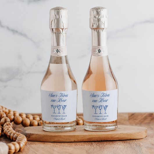 Sie bindet die elegante Hand der Knot-Küste. Schaumweinetikett