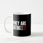 Sie essen die Hunde - sie essen die Katzen Kaffeetasse (Links)