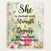 Sie ist bekleidet mit einer Blumenschrift Planer (Vorderseite)