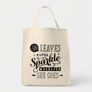 Sie verlässt eine wenige Schein-Typografie-Tasche Tragetasche