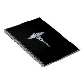 Silber wie Caduceus Medical Symbol auf schwarzer D Notizblock (Rechte Seite)