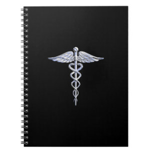 Silber wie Caduceus Medical Symbol auf schwarzer D Notizblock