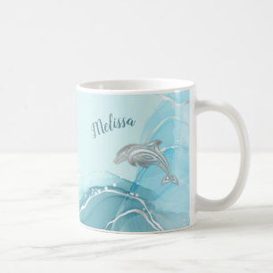 Silberne Delfine wogen Ihren Namen an der Küste Kaffeetasse