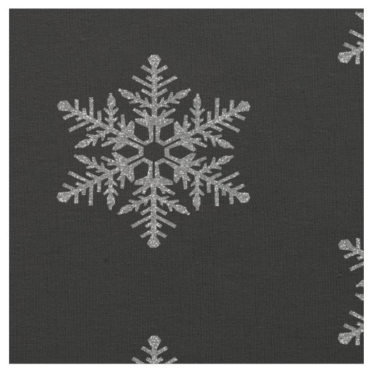 Silberne Imitat-Glitzer-Schneeflocken auf Stoff (Nahaufnahme)