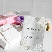 Silberne weiße Blumen prägen das Gästebuchzeichen Sockelschild