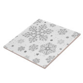 Silberschneeflocken auf weiß fliese (Seite)