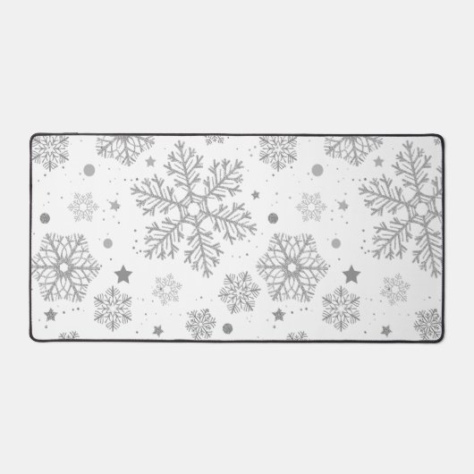 Silberschneeflocken auf weiß schreibtischunterlage (Vorderseite)