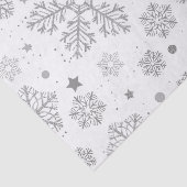 Silberschneeflocken auf weiß seidenpapier (Ausschnitt)