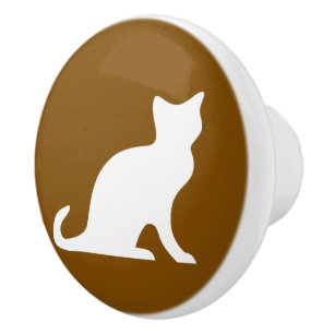 Silhouette der braunen und weißen Katze Keramikknauf