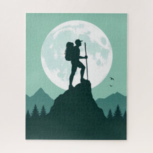 Silhouette eines Wanderers auf einem Gipfel mit Mo Puzzle