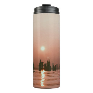 SILHOUETTE FOTO DER PERSON, DIE EINEN PADDLE SUR F THERMOSBECHER