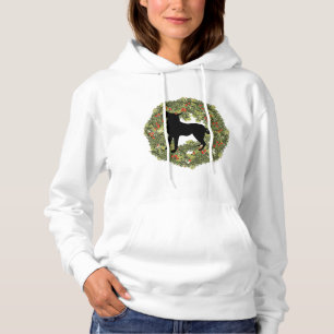 Silhouette im Schatten beim Hund im Kranz Hoodie