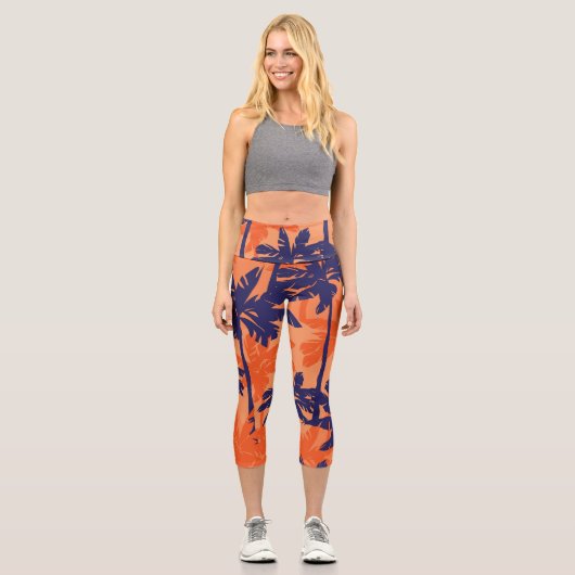Silhouette mit blauer Palme, orangefarbener Hinter Capri Leggings (Vorderseite)