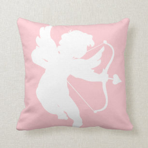 Silhouette von Kupid auf rosa Kissen