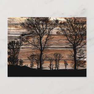 Silhouette von Waldbaum an der Stallbehörde Feiertagspostkarte