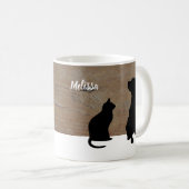 Silhouetten der schwarzen Katze Hundeauf hölzernem Kaffeetasse (VorderseiteRechts)