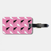 Silhouetten schwarzer und weißer Katzen auf rosa Gepäckanhänger (Rückseite horizontal)