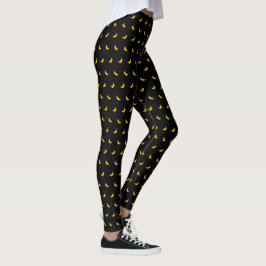 Silhouetten von kleinen Gelbbananen auf schwarz Leggings