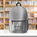 Silver Brushed Metal Schwarz-weiß Script Monogram Bedruckter Rucksack<br><div class="desc">Dieser personalisierte Rucksack ist mit einem Monogramm und einem Vornamen in modernem Schwarz-Weiß-Drehbuch auf elegantem silberfarbenem Imitat aus Metall ausgestattet.</div>